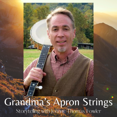 The image is a promotional graphic for a storytelling event titled "Grandma’s Apron Strings: Storytelling with Johnny Thomas Fowler." The background features a scenic landscape with mountains bathed in warm, golden light. The central part of the image shows a photo of Johnny Thomas Fowler, a man with short hair and a goatee, wearing a brown vest over a red checked shirt. He is holding a banjo over his shoulder and smiling at the camera. The event title and subtitle are displayed at the bottom of the image.