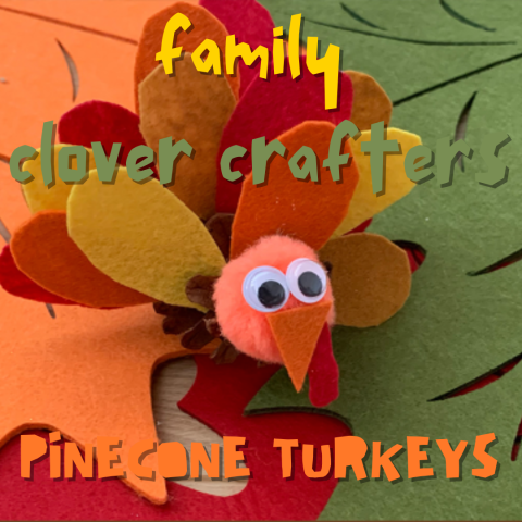 Two felt leaves are in the background. A crafted turkey sits in the middle of the image. The body is made of a pinecone, the feathers are felt, and the head is made of a pom pom. Playful fond reads: Family Clover Crafters Pinecone Turkeys.