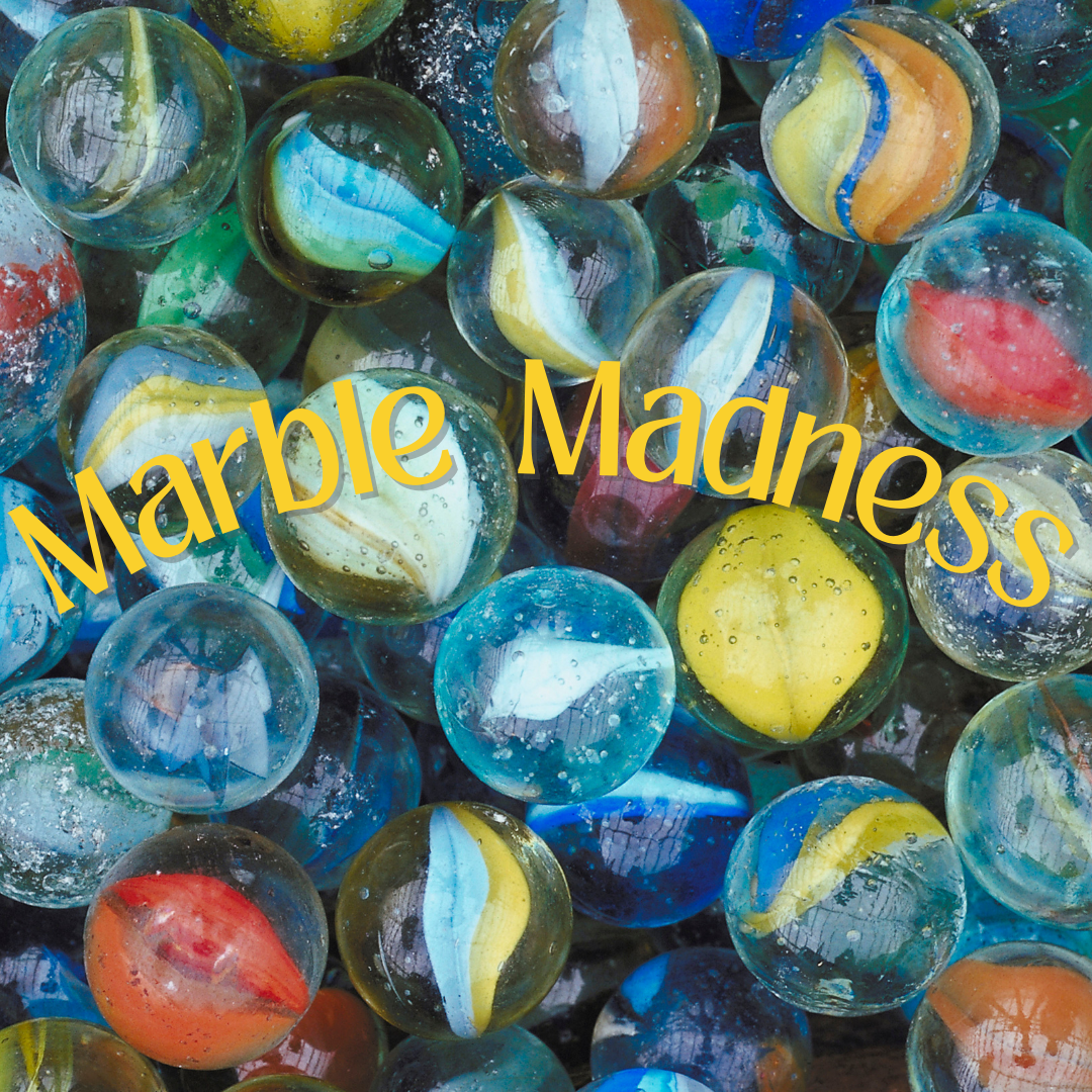 background image is a large amount of glass marbles in various colors and designs; text overlay is curved yellow text reading marble madness